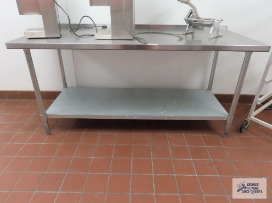 Stainless steel table. 6' x 30" x 33-3/4".
