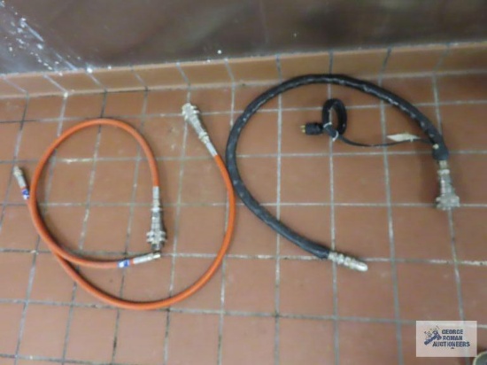 Commercial oil hoses. One has a heating element.