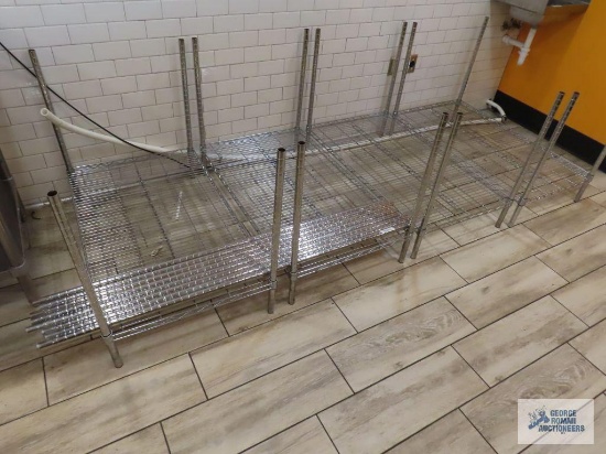 Four sets of assorted stainless steel racking pieces. These units have been cut down. The racks are