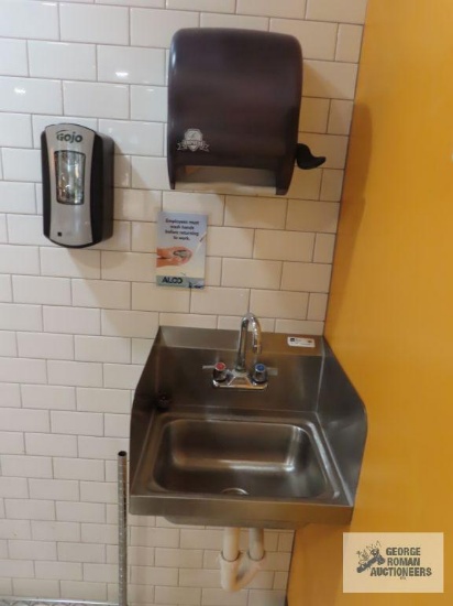 John Boos stainless steel hand washing sink with paper towel dispenser and soap dispenser. Sink is