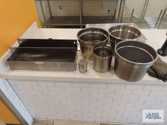 Two WinCo 22" speed rails, stainless steel soup pots, 26" x 18" sheet pans, and oven mitts.