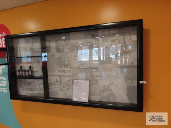 Large hanging wall display with swinging door and LED lights. 6' 3" x 3' 3" x 6". The decorative