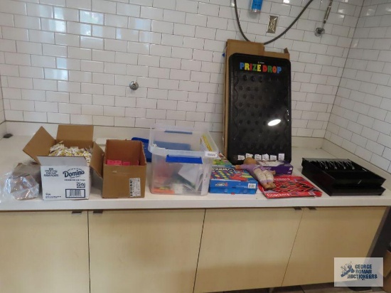 Domino Sugar packets, sweetener packets, pepper packets, assorted games, Win Spin prize drop game,