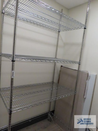 Stainless steel roll about adjustable rack made by Olympic Storage Products. 4' x 2' x 7' 8". This