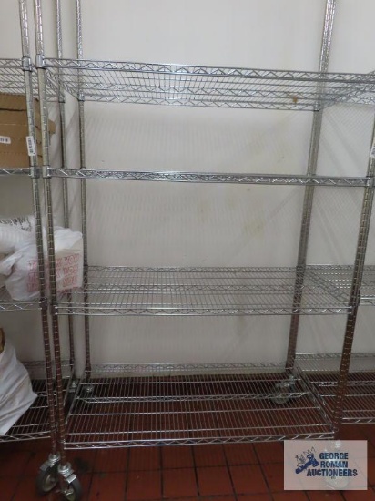 Stainless steel roll about adjustable rack made by Olympic Storage Products. 4' x 2' x 7' 8". Rack