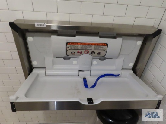 Stainless steel hanging diaper changing station. Bring torx bit set and regular bit set with