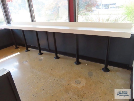 16' x 12" x 9" composite and wooden freestanding bar with six metal legs. Bring tools to remove
