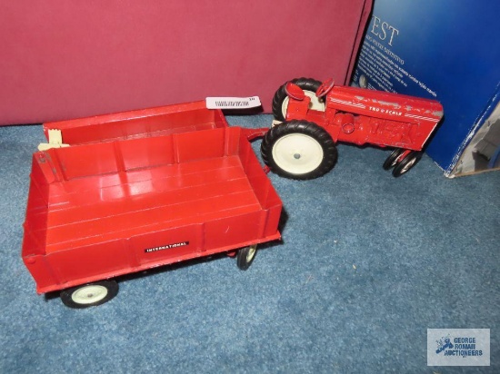 Metal tractor with two metal international trailers