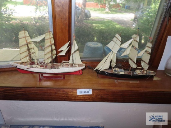 Two wooden model ships.