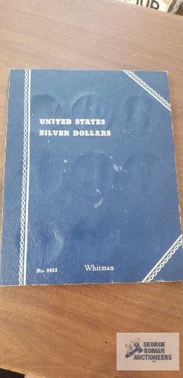 United States Silver Dollars book with (2) 1971 and (2) 1972 Eisenhower dollar coins