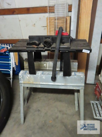 Folding metal sawhorses and router table.