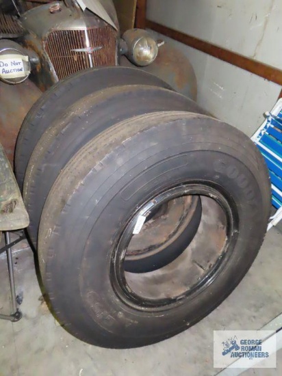 Three Goodyear G159 Unisteel 9.00 R20 tires on Dayton style rims.