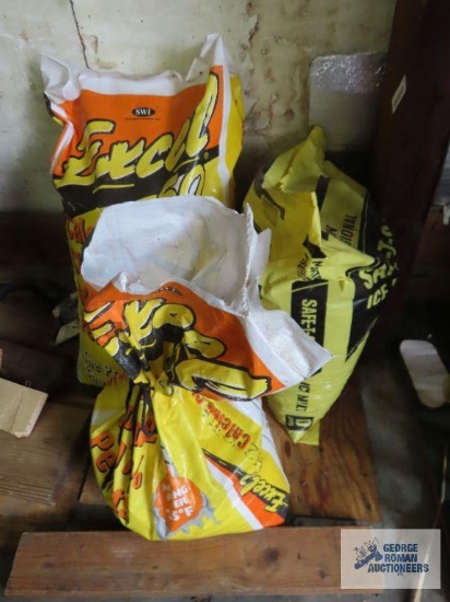 Two bags of full ice melter and one partial bag