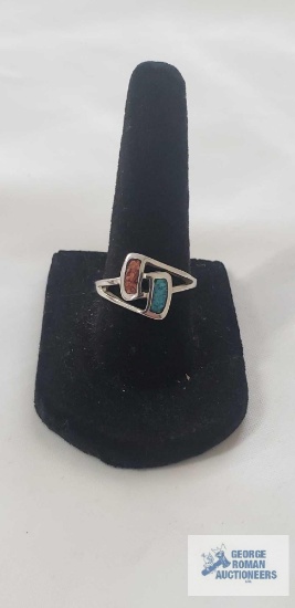 Silver colored ring with dual inlay of turquoise and red coral chips in a geometric setting, size 7,