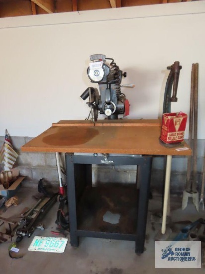 Craftsman radial arm saw in garage. The base has a hole in the bottom. We plugged this unit in and