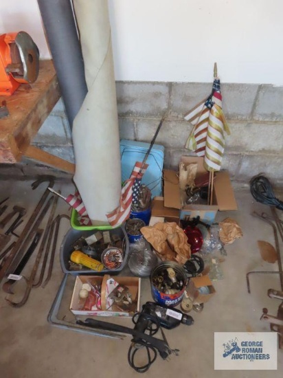 Variety of hardware, trailer light covers, bungee cords, electrical hardware, rolls of fabric, and