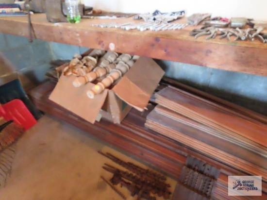 Assorted wood trim pieces and other wooden pieces.