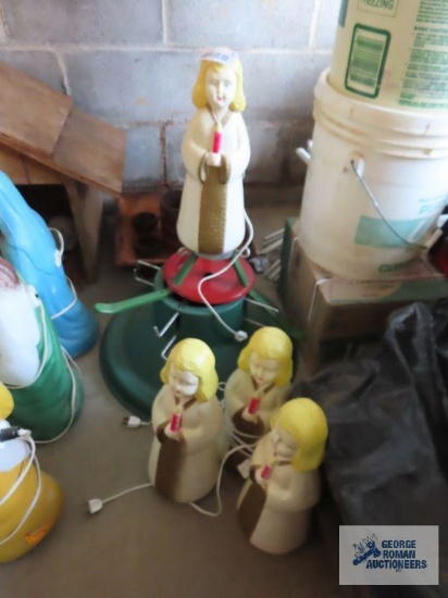Four weighted outdoor lighted angel figures. Includes 3 Christmas tree stands. They are 14".