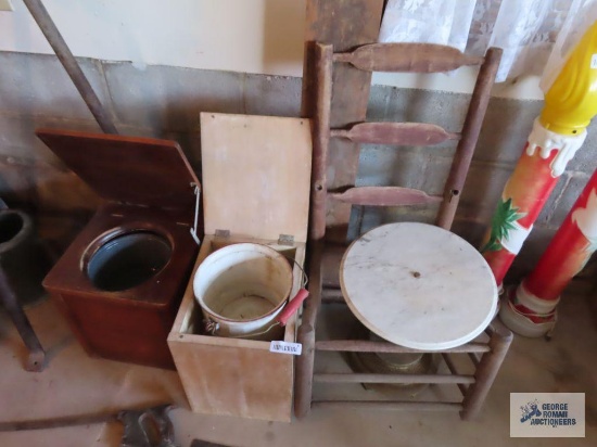 Two wooden potty chairs with enamelware pots, marble top stand, chair and bed parts.