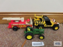 John Deere tractor, G.I. Joe jeep, and Fisher Price fire engine