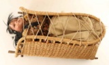 Papoose in Straw Carrier