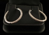 A pair of inside out diamond hoop earrings set