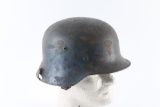 Shrapnel Damaged M35 German helmet