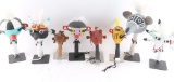 Lot of 8 Rattles in Stands.