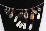 Collection of 8 Sterling Silver Pendants.
