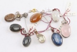 Collection of 8 Sterling Silver Pendants.