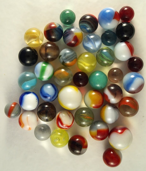 Group of 42 Assorted Marbles. Largest is 6/8".