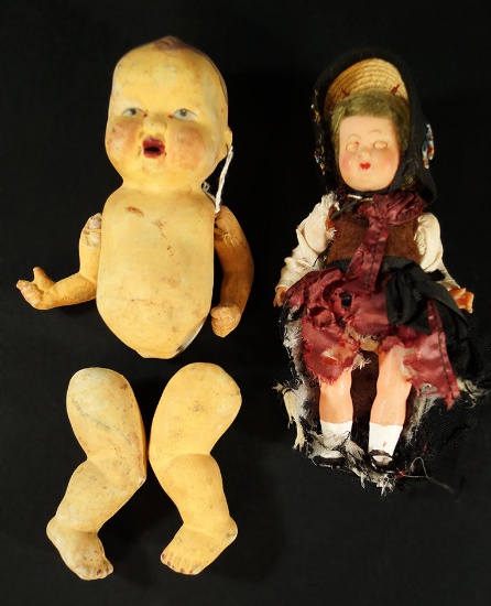 Pair of Dolls. Porcelain & the other one is Composite with Clothing.