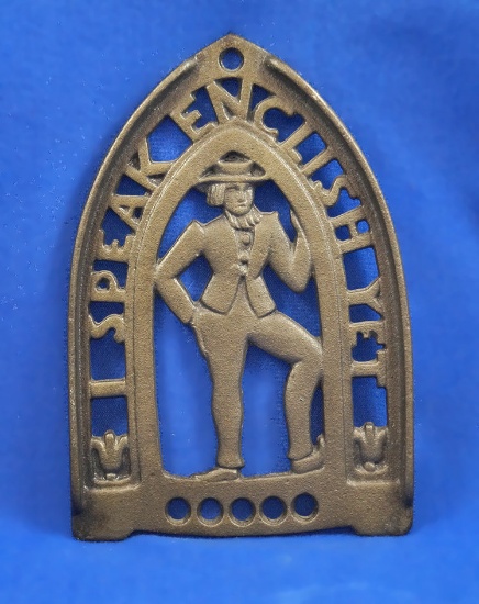 Trivet with man, "I Speak English Yet", "iron art  19", 6" long