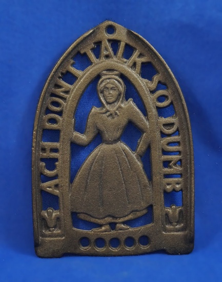 Trivet with woman, "Ach Don't Talk So Dumb", "iron art 18",  6" long