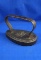 Oval Flat iron, cast iron, girl riding horse pictured on base, Ht 4