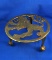 Beautiful brass trivet stand with lion as cut-out, paw feet.  $150