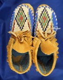 Pair of contemporary beaded moccasins in new condition