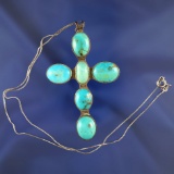 Antique Southwestern sterling silver and turquoise cross that is 2 3/4