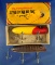 Pair of vintage fishing lures including a boxed South Bend Baso Oreno Red/Yellow.