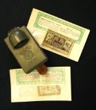 Militaria: WWII German Daimon Telko field torch / flashlight and German emergency paper money, and a