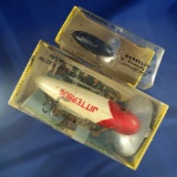 Pair of Fred Arbogast jitterbug vintage fishing lures. Muskie and spinner size with boxes.