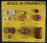 Set of assorted pottery, stone, shell and bone beads and ornaments found in Nodena Arkansas