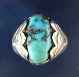 Men's silver and turquoise Zuni ring in good condition.