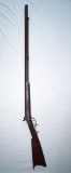 1860s small caliber half stock black powder percussion rifle with a brass trigger guard and butt pla