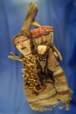 Nicely styled pre-Columbian textile doll depicting a man, woman and child from Peru.