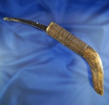 Alaskan historic era Knife made from caribou antler with a wire wrapped handle and metal Blade.