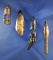 Set of four bone artifacts found in Alaska that are heavily polished from being in the ocean.