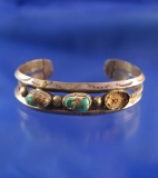 Antique Bracelet with Turquoise Inserts, one is missing.