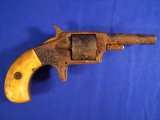 .22 caliber Pocket Revolver with bone handles and a 2 1/4