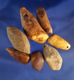 Set of seven drilled plummets made from bone found in Alaska, largest is 2 3/8